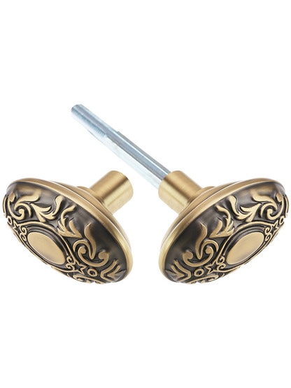 Pair of Oval Victorian Door Knobs in Antique Brass.